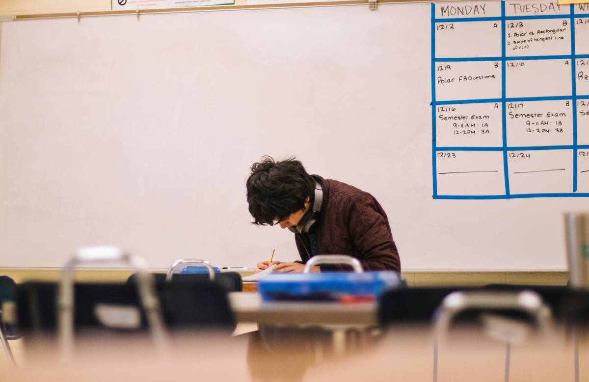 Student applying Study Smart Tips with timer and notebook to boost retention
